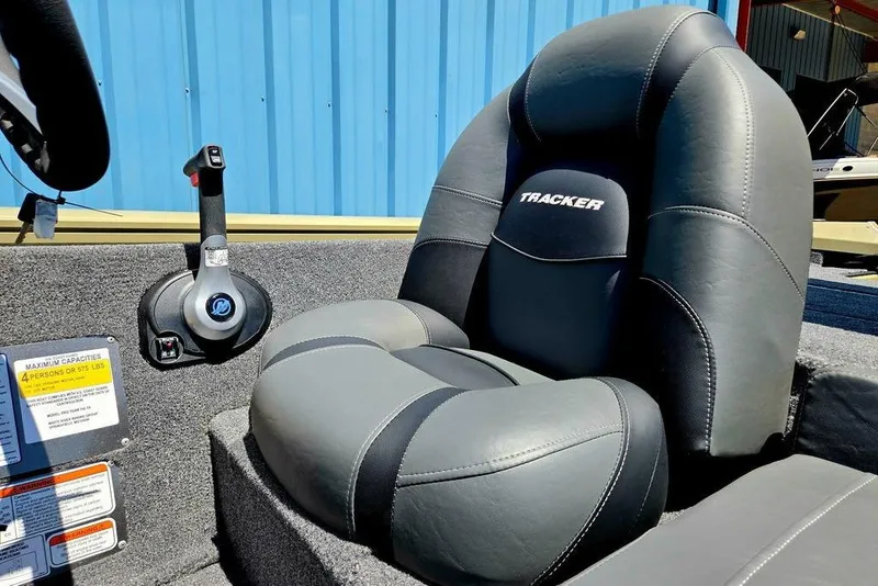 Slide: The Image of 2026 Tracker Pro Team 190 boat seat and control lever, gray upholstery. - 28