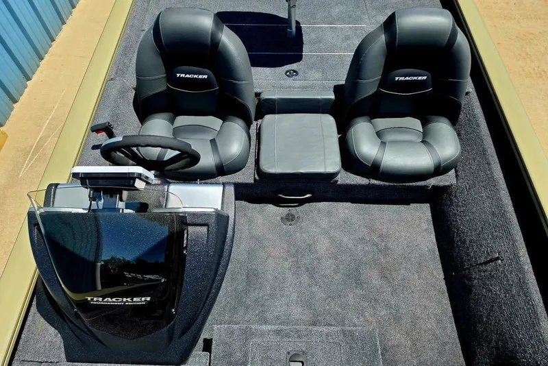 Slide: The Image of 2026 Tracker Pro Team 190 boat interior with dual seats and steering console. - 31