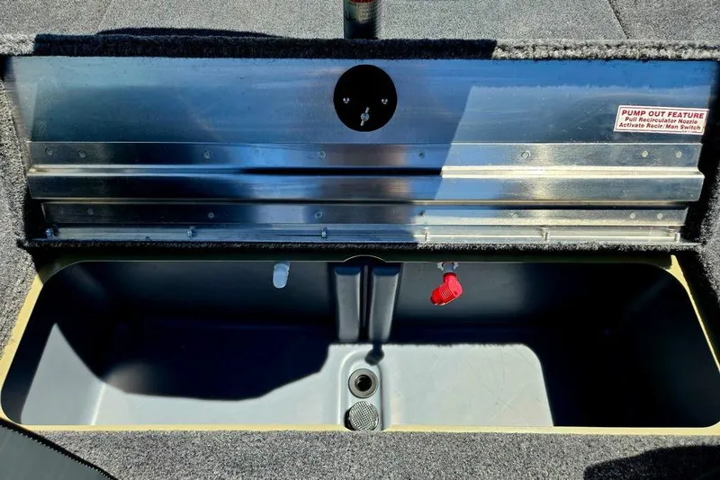 Slide: The Image of Livewell compartment of 2026 Tracker Pro Team 190 boat with pump-out feature. - 33