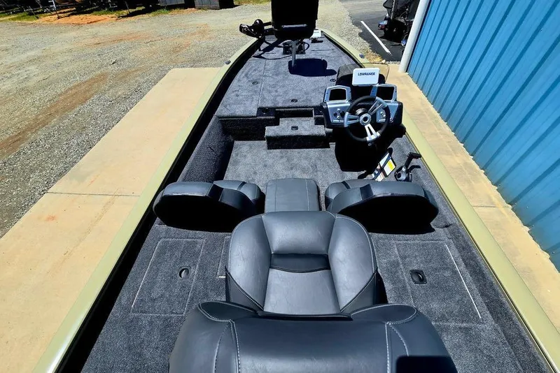 Slide: The Image of 2026 Tracker Pro Team 190 boat interior with steering console and seating. - 34
