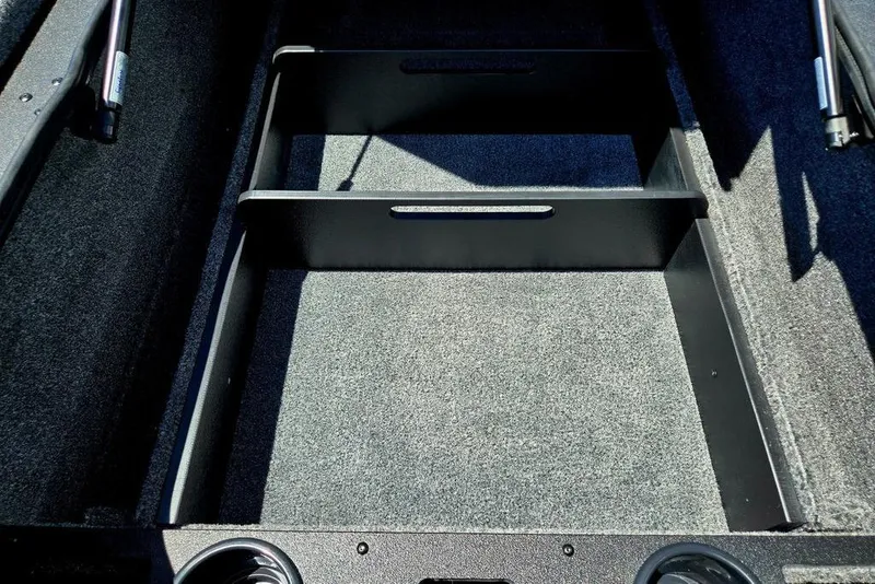Slide: The Image of Interior view of 2026 Tracker Pro Team 190 boat storage compartment. - 39