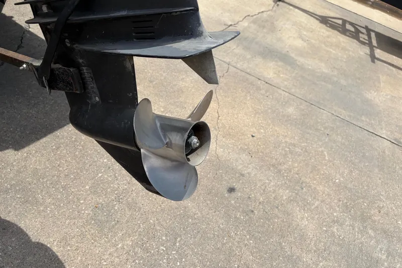 Slide: The Image of Propeller of a 1995 Tracker Pro Deep V-17 boat on concrete surface. - 12