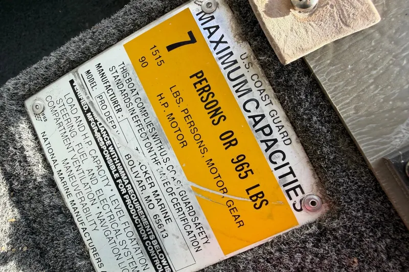 Slide: The Image of 1995 Tracker Pro Deep V-17 capacity plate, maximum 7 persons or 965 lbs, U.S. Coast Guard certified. - 5