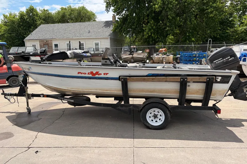 Slide: The Image of 1995 Tracker Pro Deep V-17 boat on trailer, parked outdoors. - 6