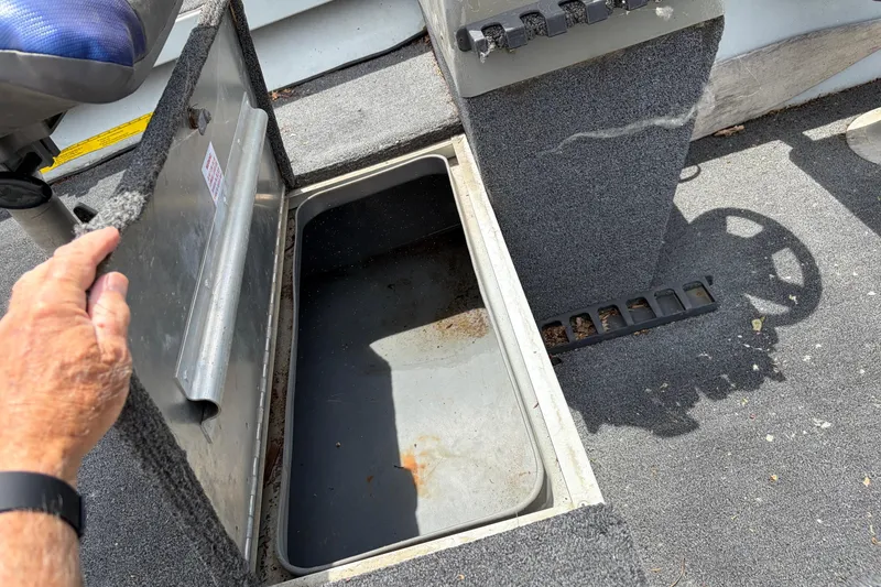 Slide: The Image of Open storage compartment in 1995 Tracker Pro Deep V-17 boat interior. - 9