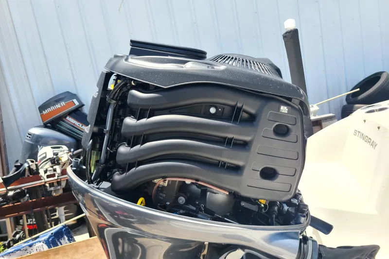 Slide: The Image of 2023 Stingray 182 SC boat engine, detailed view of outboard motor components. - 16