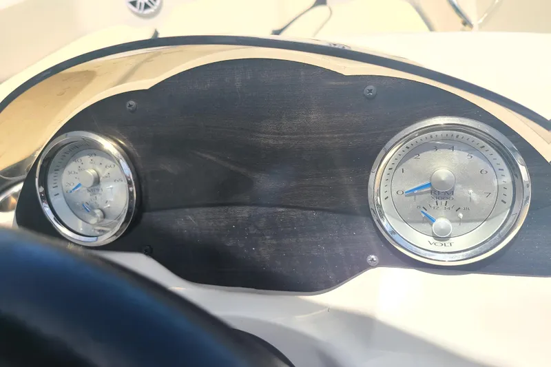 Slide: The Image of Dashboard of 2023 Stingray 182 SC boat with speedometer and voltmeter gauges. - 6