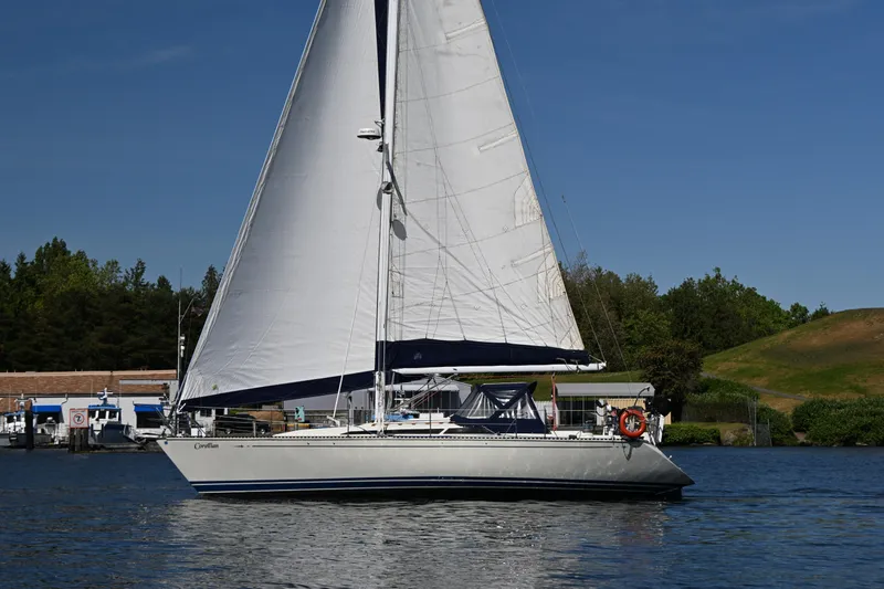 The Image of Sailboat C&C 37/40+ from 1989 on calm water, clear sky background. - 0