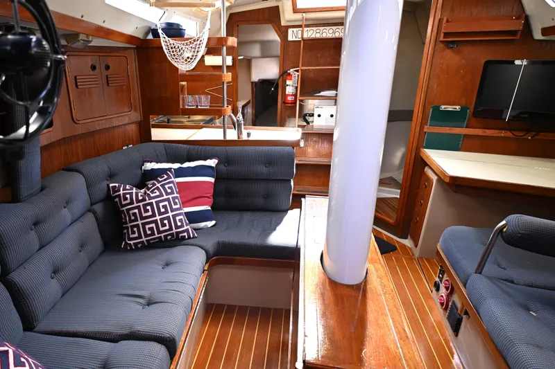 Slide: The Image of Interior of 1989 C&C 37/40+ sailboat with cozy seating and nautical decor. - 13