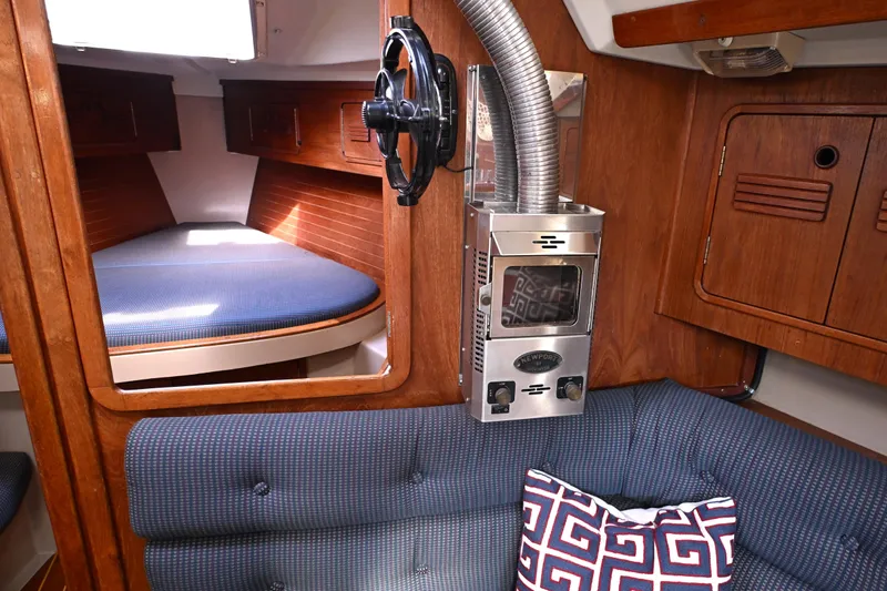 Slide: The Image of Cozy interior of 1989 C&C 37/40+ sailboat with wood finish and compact heater. - 19