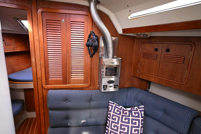 Slide: The Image of Interior of 1989 C&C 37/40+ sailboat with wood paneling and cozy seating area. - 20