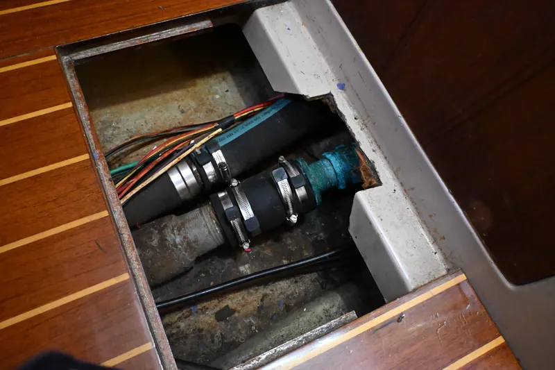 Slide: The Image of Bilge area of 1989 C&C 37/40+ sailboat showing hoses and wiring. - 25