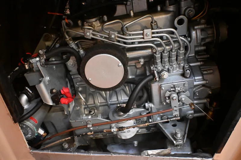 Slide: The Image of Engine of a 1989 C&C 37/40+ sailboat, showcasing intricate mechanical components. - 27