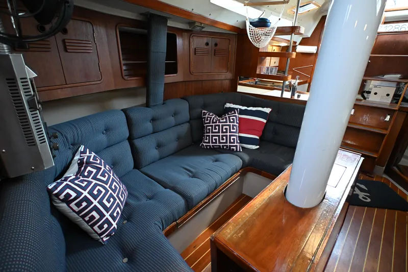 Slide: The Image of Interior of 1989 C&C 37/40+ sailboat with cozy seating and nautical decor. - 3