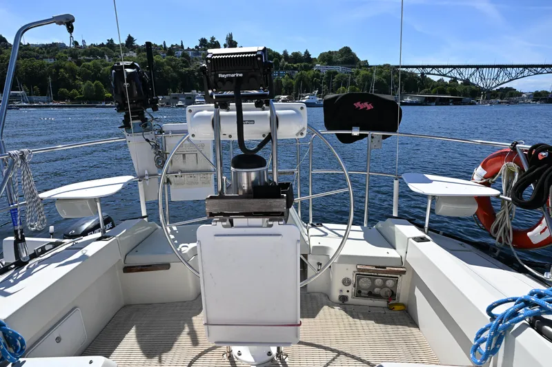 Slide: The Image of Cockpit of 1989 C&C 37/40+ sailboat with steering wheel and navigation equipment. - 31
