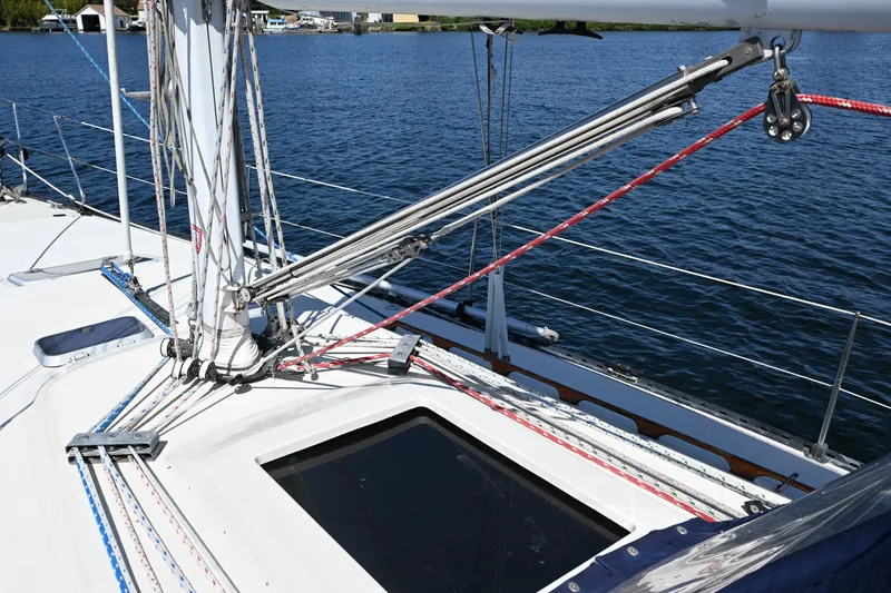 Slide: The Image of Sailboat deck of 1989 C&C 37/40+ with rigging and ropes on a sunny day. - 35