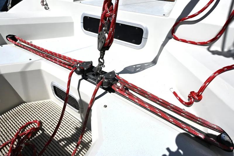 Slide: The Image of Cockpit of 1989 C&C 37/40+ sailboat with red ropes and pulley system. - 38
