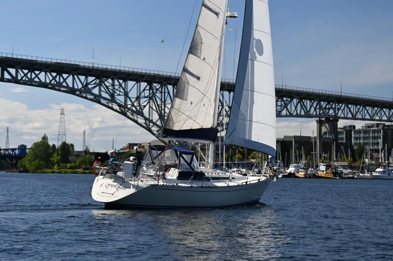 Slide: The Image of Sailboat C&C 37/40+ (1989) cruising under a bridge on a sunny day. - 41