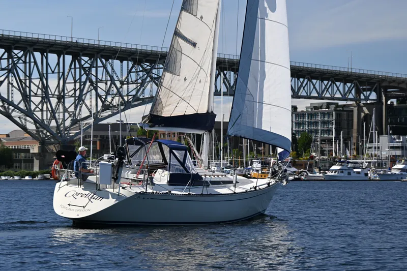 Slide: The Image of Sailboat C&C 37/40+ (1989) cruising near a bridge on a sunny day. - 42