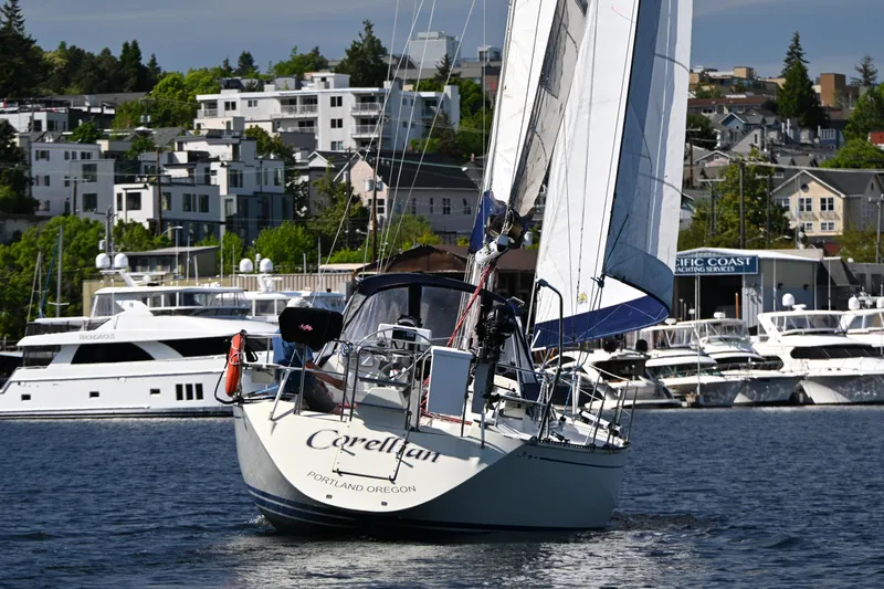 Slide: The Image of Sailboat C&C 37/40+ (1989) navigating near a marina, Portland, Oregon. - 43