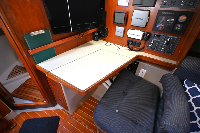 Slide: The Image of Navigation station in 1989 C&C 37/40+ sailboat with electronics and seating. - 5