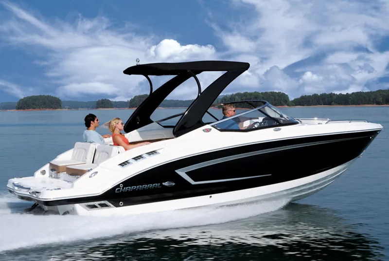 Slide: The Image of Manufacturer Provided Image: 2013 Chaparral 257 SSX speedboat cruising on a lake with passengers. - 12