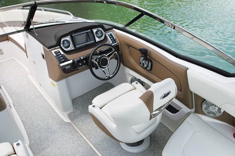 Slide: The Image of Manufacturer Provided Image: 2013 Chaparral 257 SSX boat cockpit with steering wheel and control panel. - 17