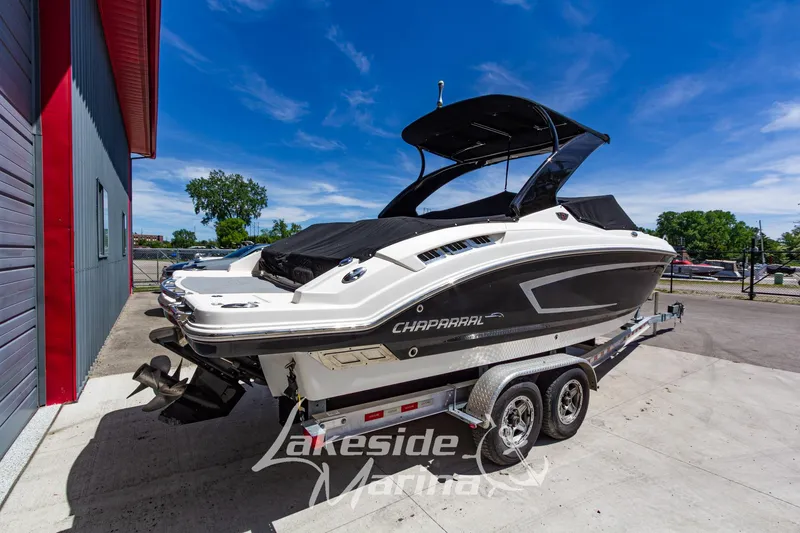 Slide: The Image of 2013 Chaparral 257 SSX boat on trailer at Lakeside Marina under clear blue sky. - 2