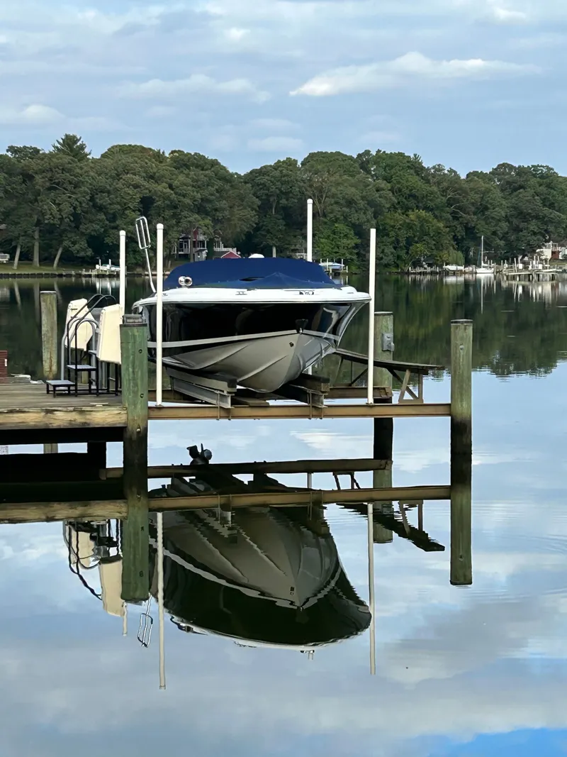 Slide: The Image of 2007 Chris-Craft Launch 22 boat docked with reflection on water. - 2