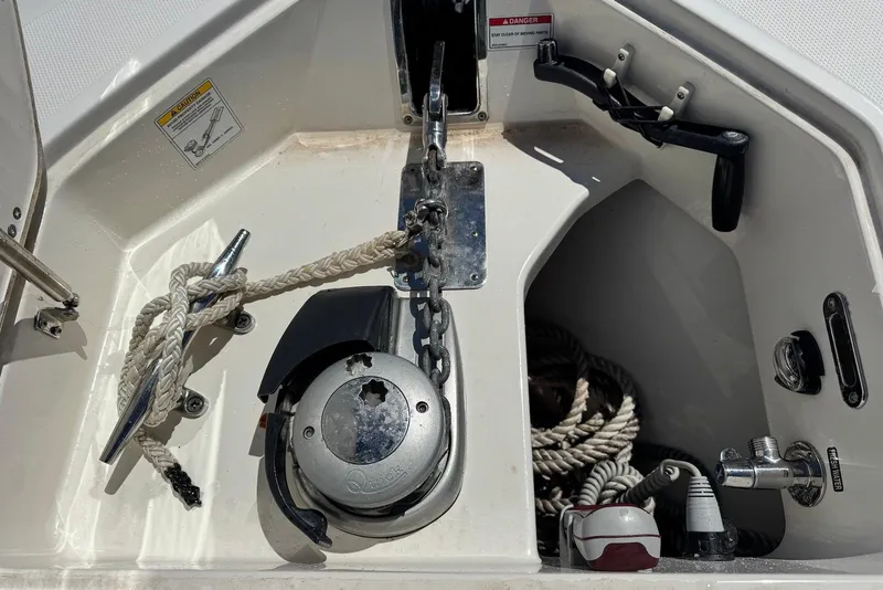 Slide: The Image of Anchor compartment of a 2019 Boston Whaler 380 Outrage with ropes and winch. - 10
