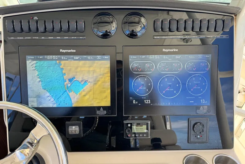 Slide: The Image of Control panel of a 2019 Boston Whaler 380 Outrage with Raymarine displays. - 15
