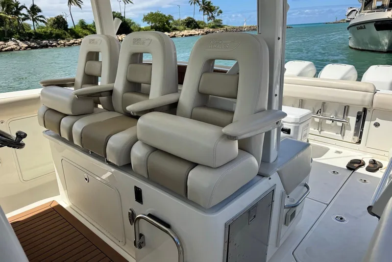 Slide: The Image of 2019 Boston Whaler 380 Outrage boat interior with luxurious seating and ocean view. - 16