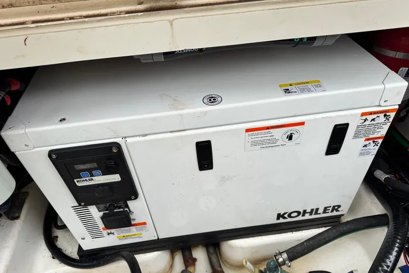 Slide: The Image of Kohler generator in a 2019 Boston Whaler 380 Outrage boat compartment. - 25