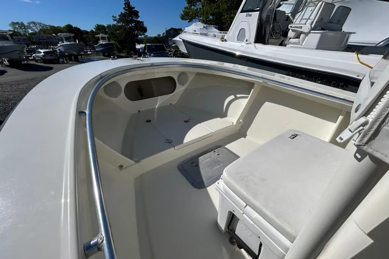 Slide: The Image of 2004 Gloucester G-20 boat interior with seating and storage, docked among other boats. - 15