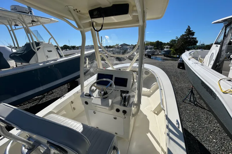 Slide: The Image of 2004 Gloucester G-20 boat cockpit with steering wheel and controls, parked outdoors. - 7