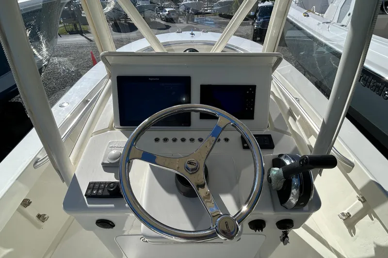 Slide: The Image of 2004 Gloucester G-20 boat helm with steering wheel and navigation screens. - 9