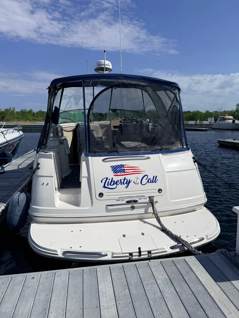 Slide: The Image of 2001 Chaparral 350 Signature boat docked, featuring "Liberty Call" signage. - 2