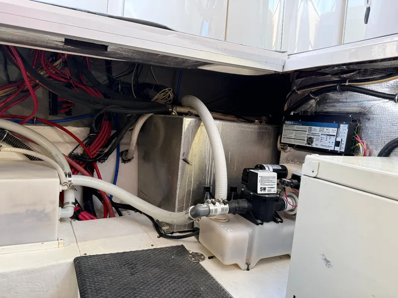 Slide: The Image of Engine compartment of 2001 Chaparral 350 Signature with wiring and pumps. - 21