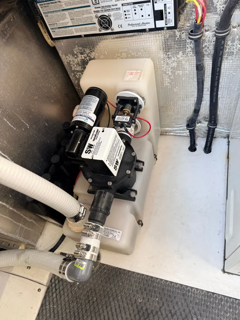 Slide: The Image of Chaparral 350 Signature 2001 boat engine room with pump system. - 23