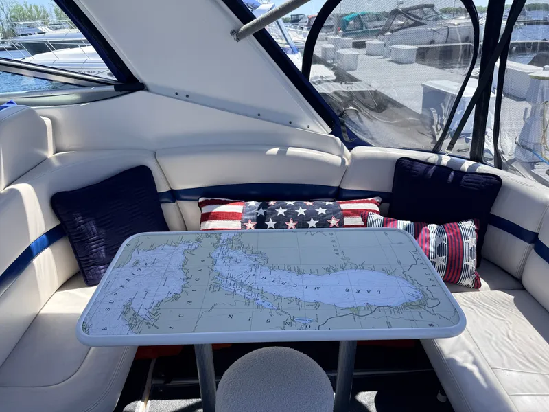Slide: The Image of Interior of a 2001 Chaparral 350 Signature yacht with decorative pillows. - 4