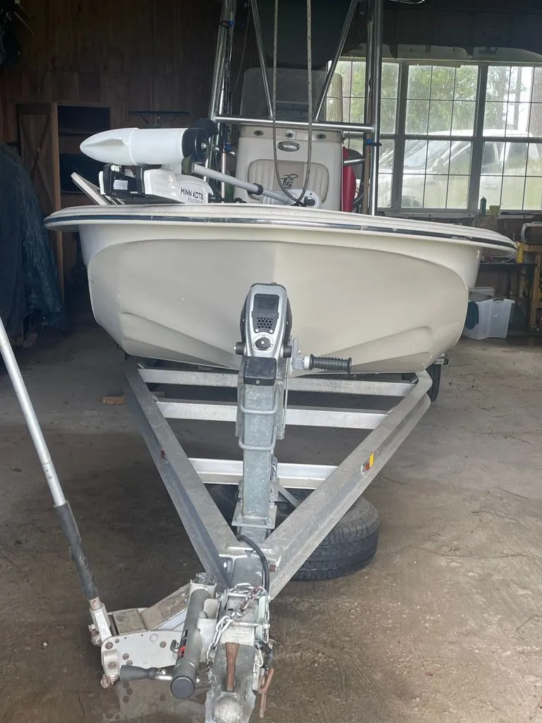Slide: The Image of 2015 Carolina Skiff 198 DLV boat on trailer in garage. - 3
