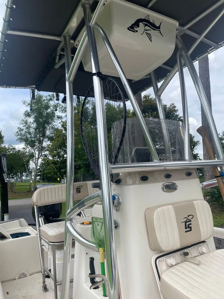 Slide: The Image of 2015 Carolina Skiff 198 DLV with T-top and fishing gear. - 4