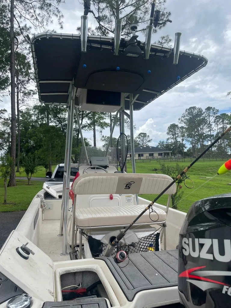 Slide: The Image of 2015 Carolina Skiff 198 DLV boat with Suzuki outboard motor. - 5
