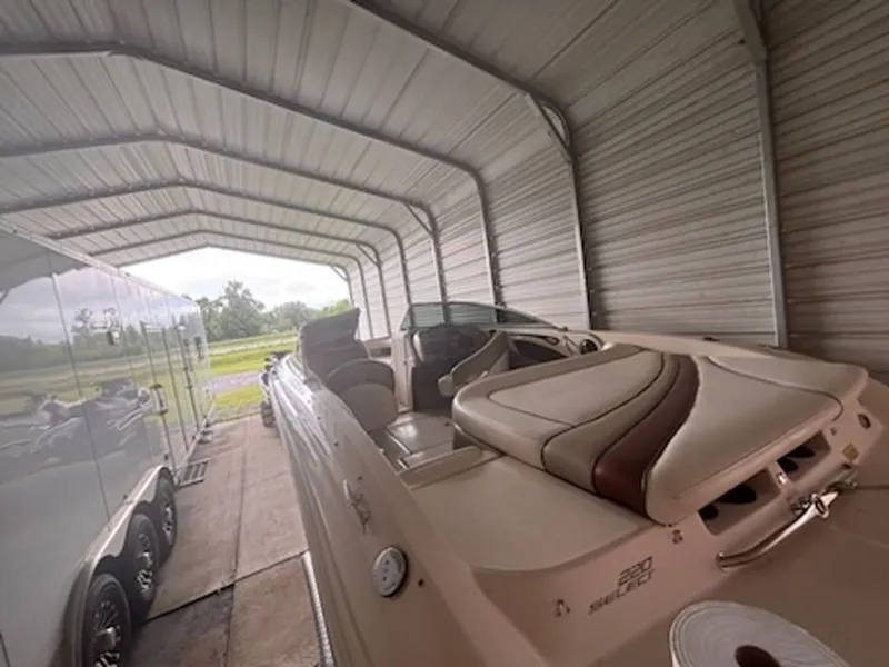 Slide: The Image of 2006 Sea Ray 220 Select boat in covered storage. - 12
