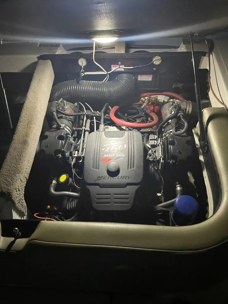 Slide: The Image of Engine compartment of a 2006 Sea Ray 220 Select boat. - 14