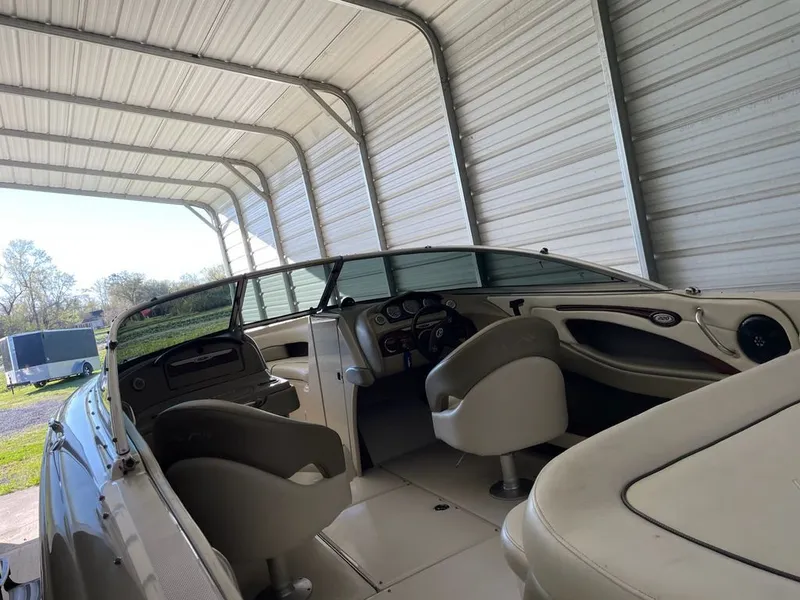Slide: The Image of Interior view of a 2006 Sea Ray 220 Select boat in a shelter. - 3