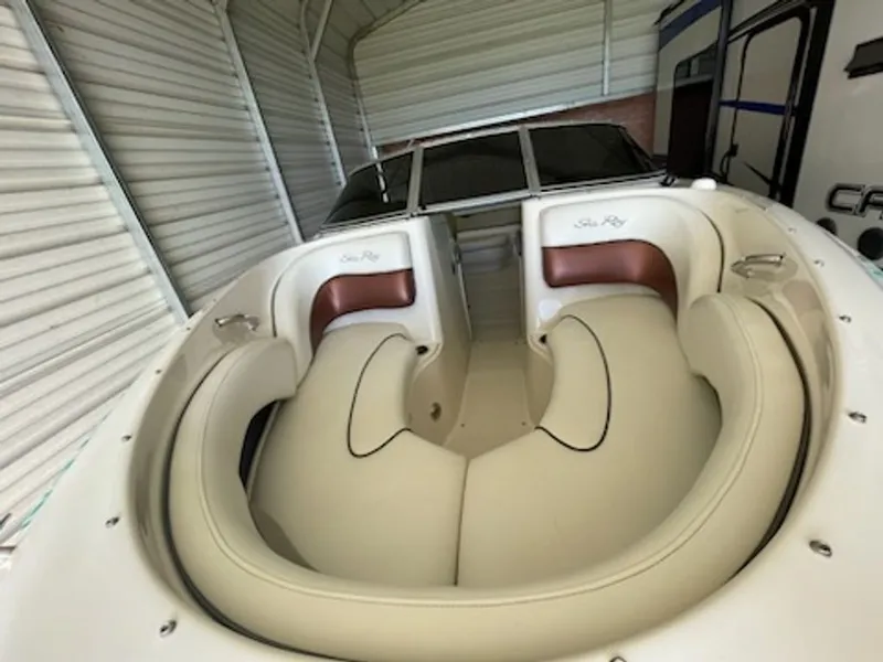 Slide: The Image of Interior of a 2006 Sea Ray 220 Select boat in a garage. - 8