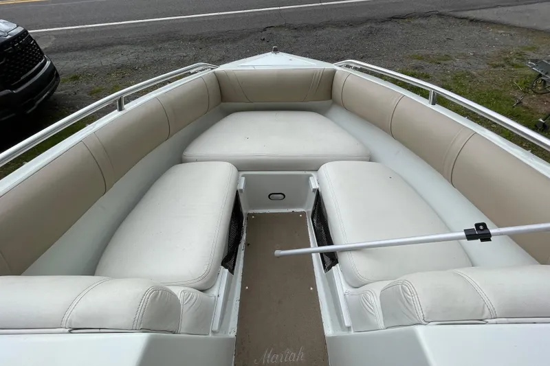 Slide: The Image of Interior of a 2000 Mariah 202 Shabah boat with beige seating. - 5