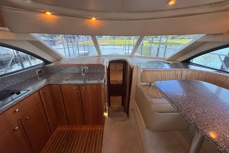 Slide: The Image of Luxurious interior of a 2003 Meridian 411 Sedan yacht with elegant wood cabinetry. - 21