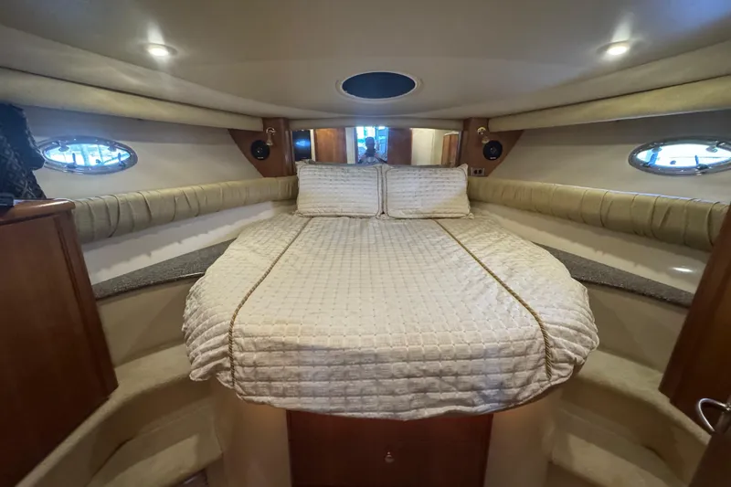 Slide: The Image of Luxurious cabin interior of a 2003 Meridian 411 Sedan yacht with cozy bedding. - 30